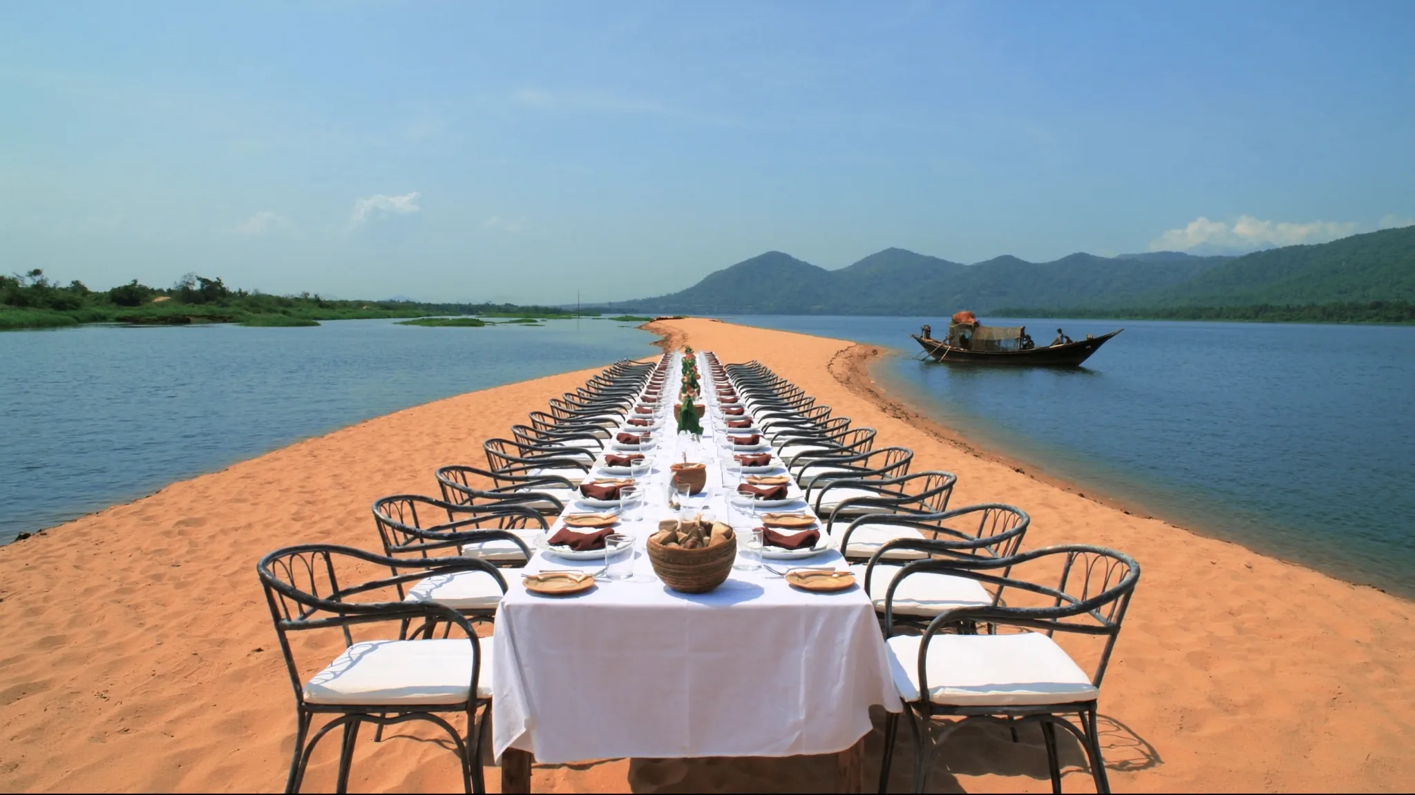 A long table on a river sandbar